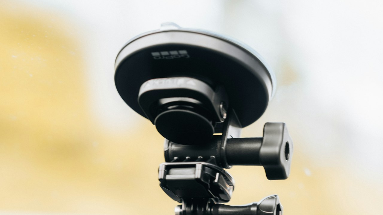 A dash camera mounted behind a car windscreen, facing the road